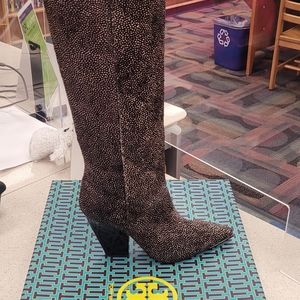 Pointed gold-tip toe boot.Striking in spotted calf hair, with slanted block heel